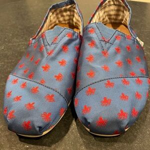 TOMS Navy slip on with red octopus embroidery Men’s size 10.5